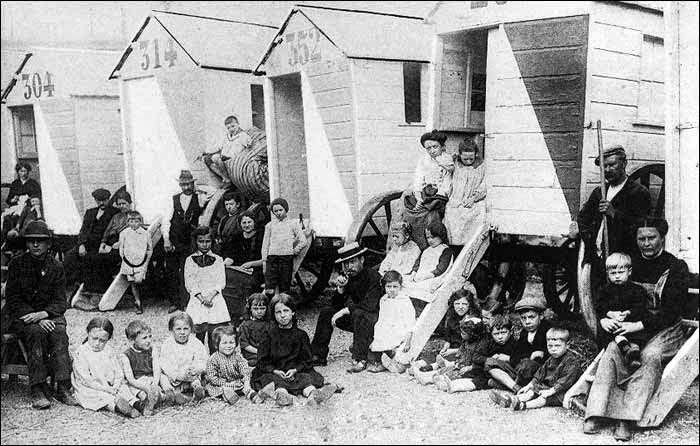 Belgian refugees, temporarily housed in beach cabins in Ostend during World War One, before moving to England or France.